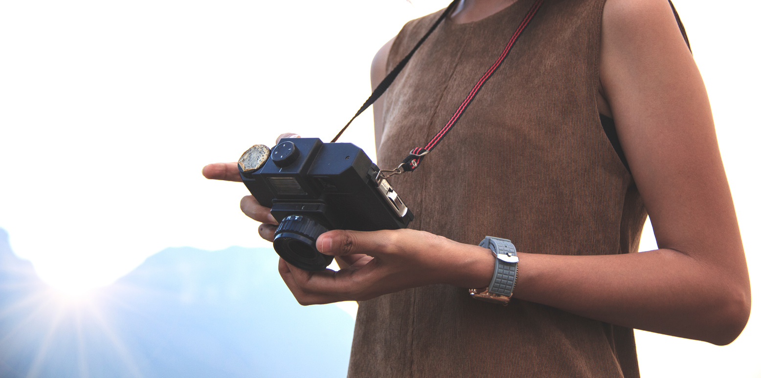 Hipster Traveler with Backpack and Taking Photo of Amazing Lands